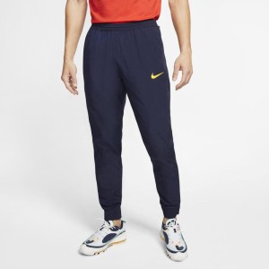 Męskie spodnie piłkarskie z tkaniny Nike F.C. - Niebieski