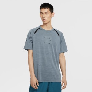 Męska koszulka funkcjonalna z krótkim rękawem Nike Sportswear Tech Pack - Niebieski