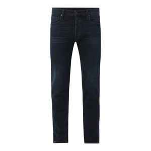 Jeansy o kroju slim fit z listwą guzikową